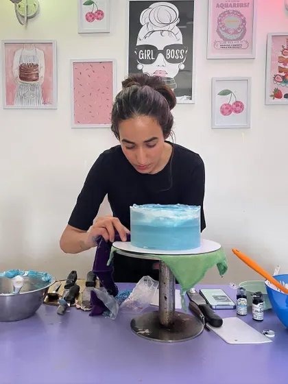 A candid shot of me working on a blue watercolor effect cake. I'm so grateful that I get to do what I love every day and be a small part of your celebrations.