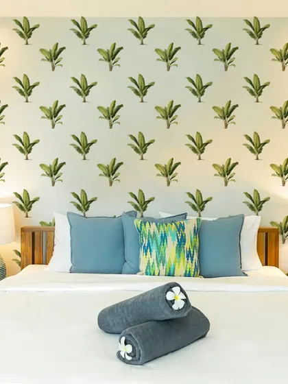 Our Wavy Banana Tree Wall Sticker pattern creates a fun and tropical feature wall in this bedroom. The design is perfect for adding a playful and relaxing vibe to your personal space.