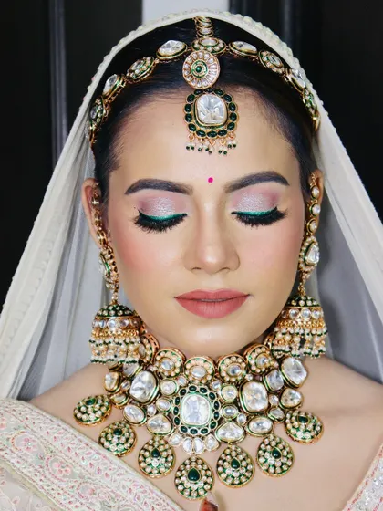 A close-up of the face, showing the flawless HD makeup in detail.