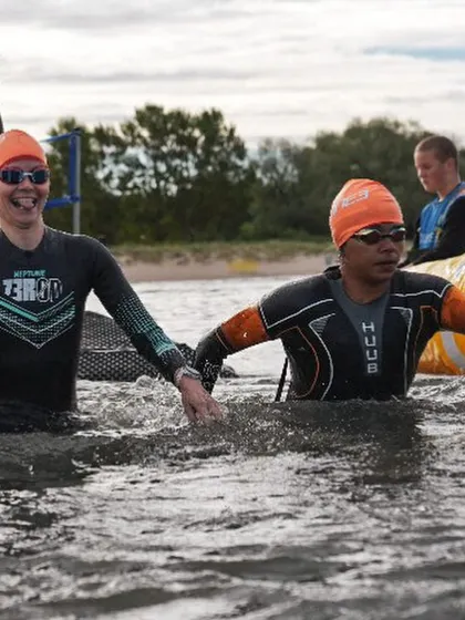 A moment of camaraderie in the chilly waters of Estonia. Even in a race, you're surrounded by people sharing the same crazy experience.