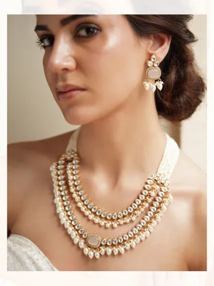 A classic layered pearl and polki necklace, perfect for an elegant and timeless look.