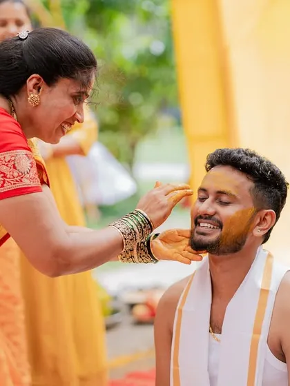 A mother applies Haldi to her son, a simple yet profoundly emotional moment that I am always honored to capture.