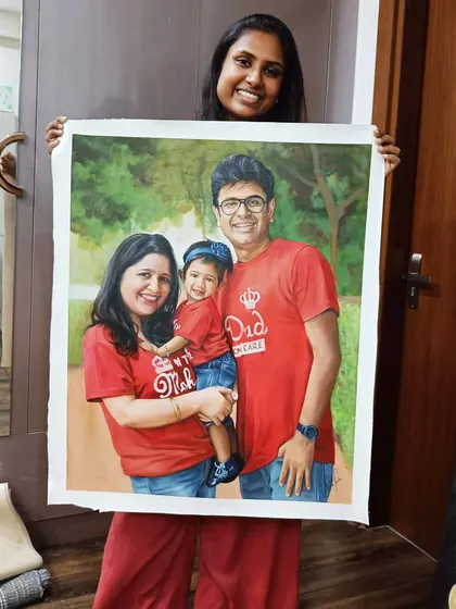 Me holding the large, completed family portrait on an un-stretched canvas.