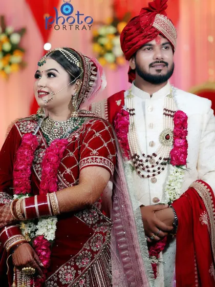 A classic portrait of the bride and groom on their wedding day, capturing their regal attire and happy expressions.