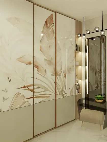 The walk-in wardrobe area features custom-printed glass shutters with a feather motif, adding a soft, artistic touch.