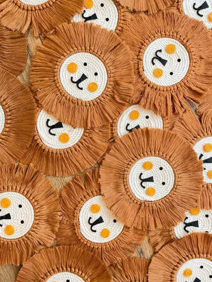 A whole pride of lion faces! I made this large batch for a custom order, and I just love how they look all together.