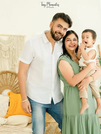 A burst of laughter makes for the best photograph. This candid moment captures the pure joy of being together as a family in a relaxed and beautiful setting.