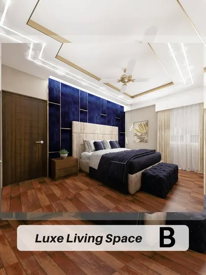 Here is another take on a luxe bedroom, this time with a deep blue velvet headboard and back panel. The design maintains a sophisticated feel with rich wooden flooring, a geometric false ceiling, and elegant, sheer curtains.