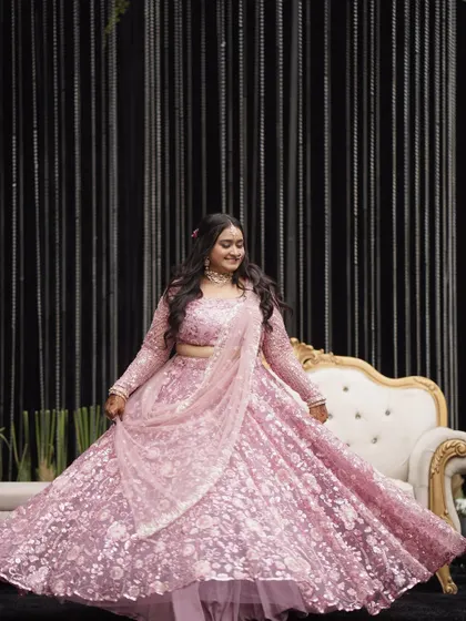 The twirl shot shows how the makeup and outfit come together for a fairytale moment. The soft glam ensures she looks stunning from every angle.