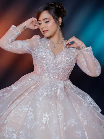 A playful and graceful pose. This look was designed to be versatile, looking beautiful whether she was posing for photos or dancing the night away at her reception.