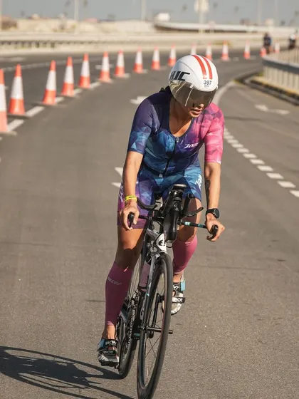 Riding hard on the flat, windy course of Ironman Bahrain. Maintaining an aero position is key to cutting through the wind.