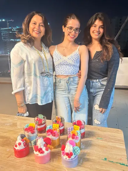 A mother and her two daughters after a wonderful family candle making session on our balcony.