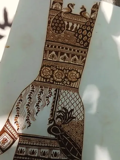 A practice sheet showing a full hand design. I'm always sketching and creating new patterns to offer my clients the most beautiful and unique mehendi art.