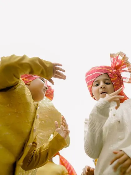 The little ones bring their own style to the Haldi dance floor, dressed in traditional kurtas and festive turbans.