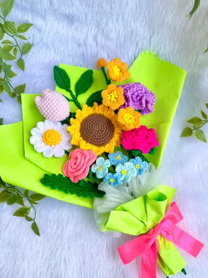 The vibrant bouquet resting on a soft white background, showing off its bright colors and cheerful arrangement.