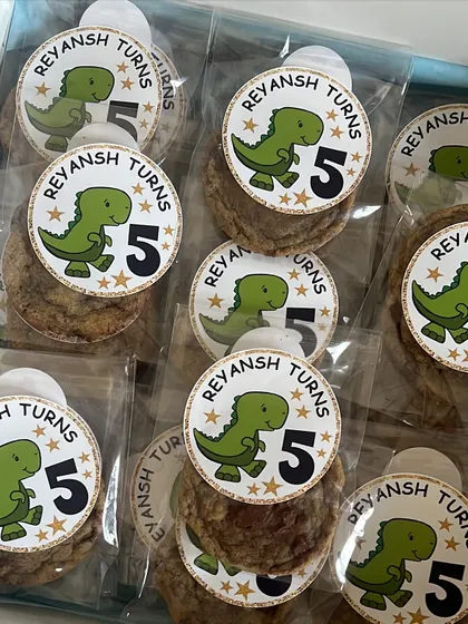 Fun and personalized party favor stickers for a 5th birthday, featuring a cute dinosaur design. We can create custom stickers for any event or theme.
