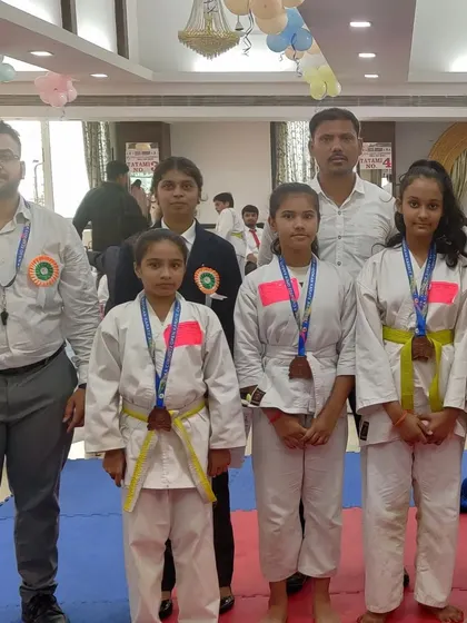 A group of our female students with their medals at the UBKA Cup. We are proud to foster a strong and supportive environment for girls and women in martial arts.