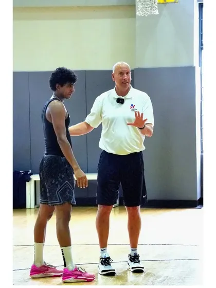 Coach Phil Galvin, a top skill development instructor, providing one-on-one feedback to an athlete.