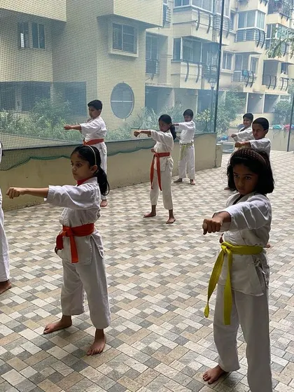 A close-up view of students focusing on their choku-zuki (straight punch) form. Precision and technique are emphasized over brute force.