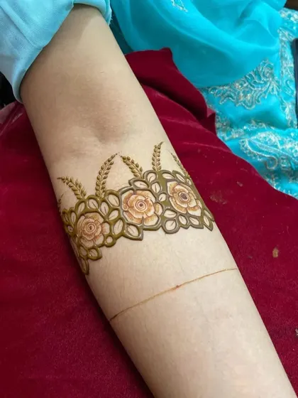 The initial outline of a floral armband. This shows the precision and care that goes into creating the foundation of every intricate design.