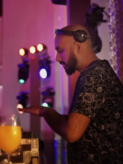 In the zone behind the decks in Marrakech, with a fresh juice to keep the energy up for a long night of music.