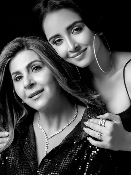 A classic black and white version of the mother-daughter portrait, adding a timeless and emotional quality to the image.