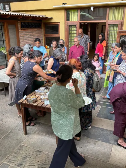 This is what a 'Koota' or gathering looks like. Our outdoor courtyard filled with people sharing food and laughter during a Local Food Club potluck. Community is at the center of everything we do, and nothing brings people together like good food and great conversation.