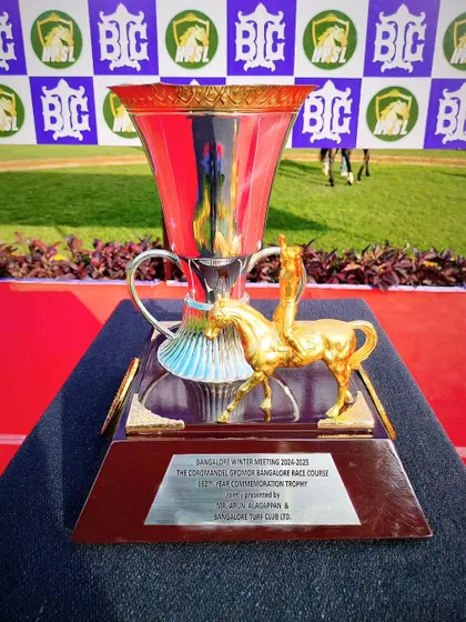 The Coromandel Gromor Commemoration Trophy, featuring a golden jockey and horse figurine.