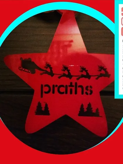 This vibrant red star-shaped ornament features a silhouette of Santa's sleigh flying across the night sky. It can be personalized with a name for a fun and festive touch.