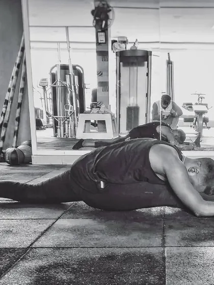 Taking the split practice to the gym floor. It's a reminder that you can find your yoga space anywhere, and that flexibility and strength go hand in hand.