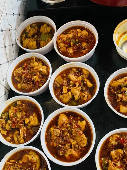 Several orders of my chicken curry, ready to be sent out to my customers.
