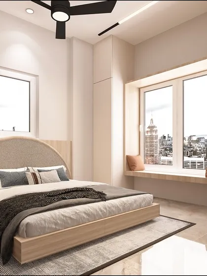 Another angle of the guest room, showing the cozy window seat that offers a lovely view of the city. The design is uncluttered and filled with natural light.