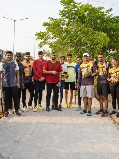 The group poses for a photo during a refreshment stop, capturing the camaraderie of the event.