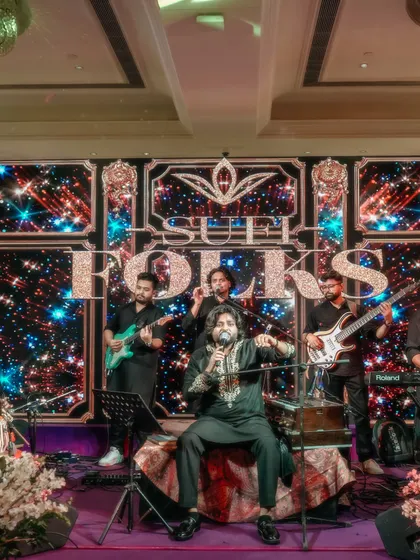 The full band on stage, ready to perform. This image showcases our complete setup and professional look, assuring clients of a high-quality production.