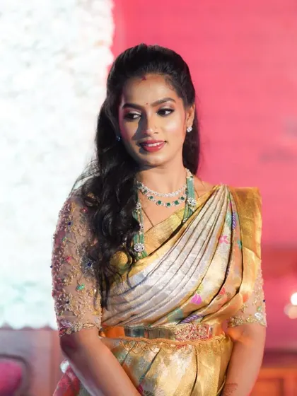 A full view of this stunning reception ensemble. The intricate embroidery on the blouse and the beautiful pastel colors are truly captivating.