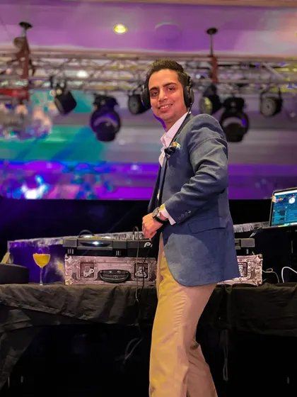 Keep 'em rolling, they said. A candid shot of me enjoying the party, ready to drop the next beat at a fun cocktail event.