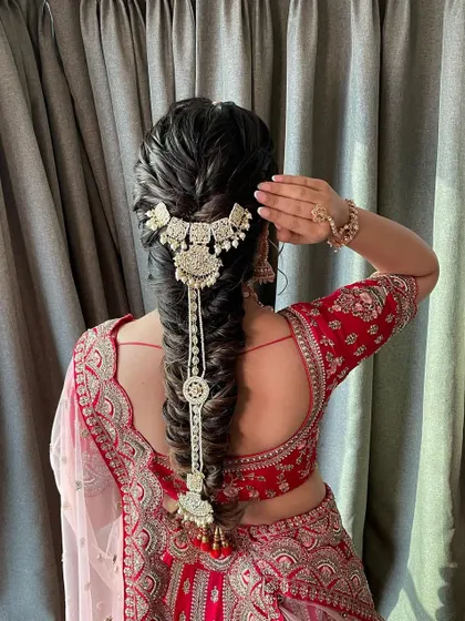 A beautiful textured bridal braid. I love how the intricate fishtail braid is adorned with a stunning traditional accessory, creating a look that is both modern and timeless.