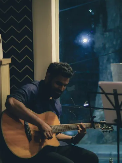 A guitarist from the 90's Jukebox band, lost in the rhythm. The dark, cozy atmosphere of our venue is perfect for late-night gigs and soulful music sessions.