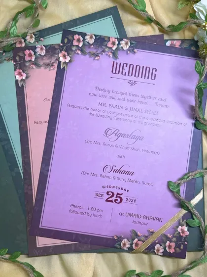 A beautiful example of a multi-event invitation suite. Each insert uses a different pastel shade, from purple to pink to green, while the floral theme keeps everything cohesive.