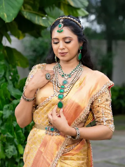 This look from my 'Athiloka Sundari' series features me in a pure Kanchi saree. I paired it with a blouse adorned with intricate embroidery and semi-precious stone embellishments, creating a regal outfit designed to make any bride feel like a princess.