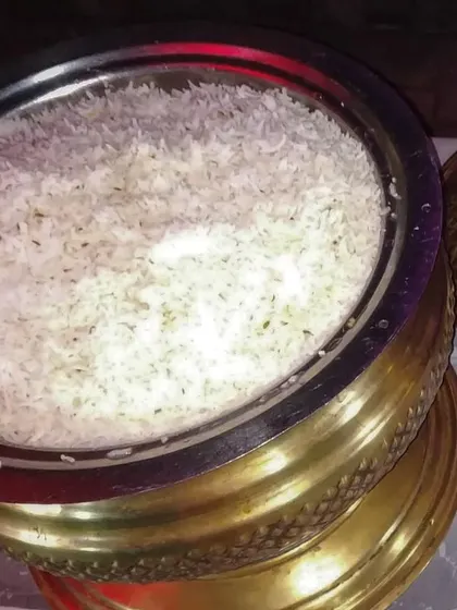 Even the simplest dishes are made with care. This is our perfectly cooked Jeera Rice, served in a traditional brass pot. It's the ideal, simple accompaniment to our flavourful curries and dals.