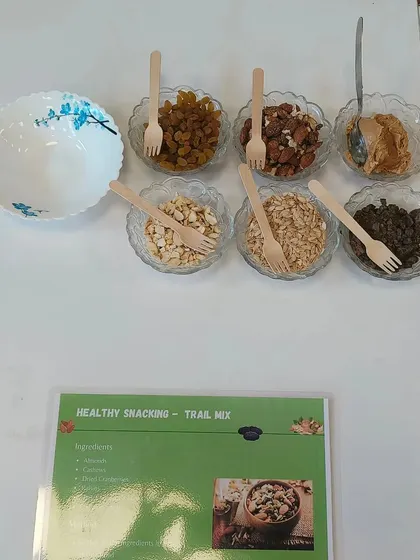 This is a setup for our 'Healthy Snacking - Trail Mix' station. We provide a variety of nuts, seeds, and dried fruits, allowing employees to create a personalized, energy-boosting snack to keep at their desks.