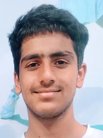 A portrait of Prateek Sheoran, who advanced to the Semifinals of the Fenesta Open Boys U-16 category after a thrilling three-set victory.