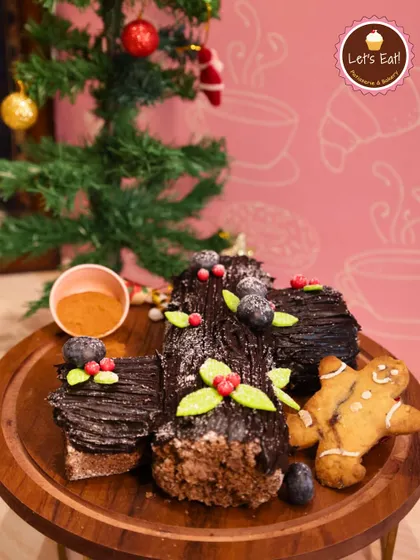The Bûche de Noël, or Yule Log, is a traditional Christmas centerpiece. My version features a rolled chocolate sponge with creamy filling, decorated to resemble a log with festive holly and berries.