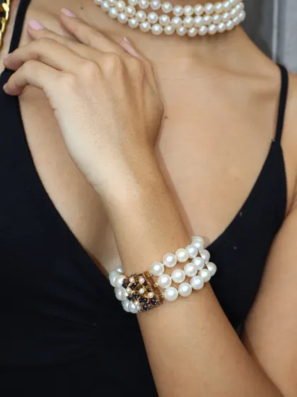 Introducing 'Breakfast at TMJ,' my tribute to an iconic era of elegance. This three-strand pearl bracelet with a vintage-style clasp is a piece of timeless glamour.