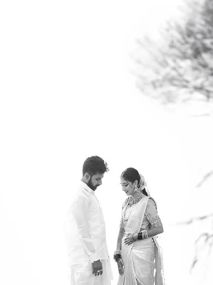 A high-key black and white portrait that creates an ethereal, almost dreamlike effect. This artistic style is perfect for capturing a moment of quiet connection.