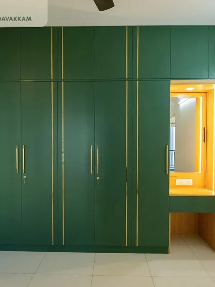 Another view of the elegant forest green wardrobe in the Casagrand Zenith master bedroom, showcasing the seamless finish and custom design.