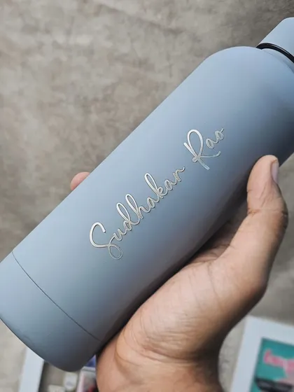 The same Quench bottle style, this time personalized with an individual's name. The elegant script stands out against the smooth matte grey finish.