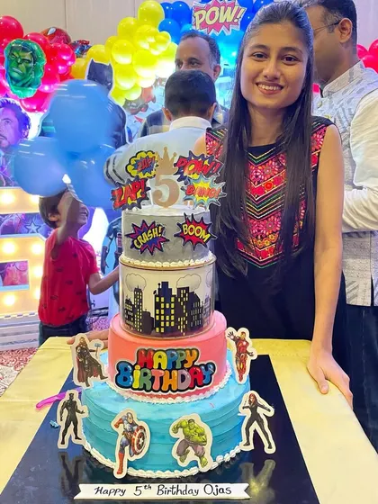 Me with the 4-tier Avengers theme cake. It was an honor to create this centerpiece for Ojas's 5th birthday celebration.