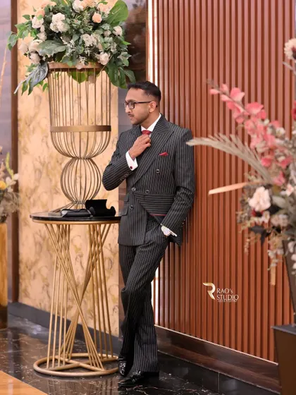 Mr. Basrah in his tailored pinstripe double-breasted suit, a perfect choice for a formal event.